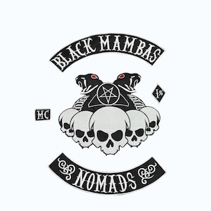 May include: Embroidered patch with the words "BLACK MAMBAS" above a design featuring two snakes with red eyes, a pentagram, and skulls. The word "NOMADS" is below the design. Also includes "MC" and "1%" patches.