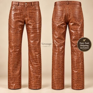 May include: A pair of brown trousers featuring a textured crocodile skin pattern. The trousers are shown from both the front and back views, displaying a classic five-pocket design with belt loops and a button closure. The text Vevouge Leather Co. is visible.