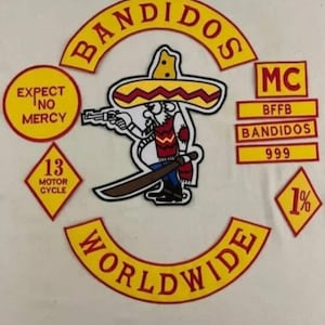 May include: A set of embroidered patches featuring a central cartoon figure in a sombrero holding a pistol and sword. Text includes BANDIDOS, WORLDWIDE, EXPECT NO MERCY, MC, BFFB, 13 MOTOR CYCLE, 999, and 1%. The patches are yellow with red borders.