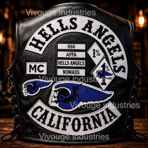 May include: A black leather vest featuring white embroidered patches with the text HELLS ANGELS, CALIFORNIA, MC, 666, AFFA, HELLS ANGELS, NOMADS, and 1%. The vest includes blue and white winged skull patches and a diamond-shaped 1% patch with a skull.