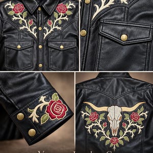 May include: A black leather jacket featuring intricate embroidery of red roses and green vines on the chest and cuffs. The back displays a large embroidered steer skull surrounded by roses. It includes gold-tone snap buttons and two chest pockets.