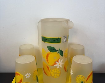 Vintage 1970s plastic pitcher and four collectible lemonade glasses made in France.