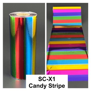 May include: A roll of colorful candy stripe foil with vertical stripes in red, green, blue, and yellow. The foil is shiny and reflective. The text "SC-X1 Candy Stripe" is displayed in a white box.