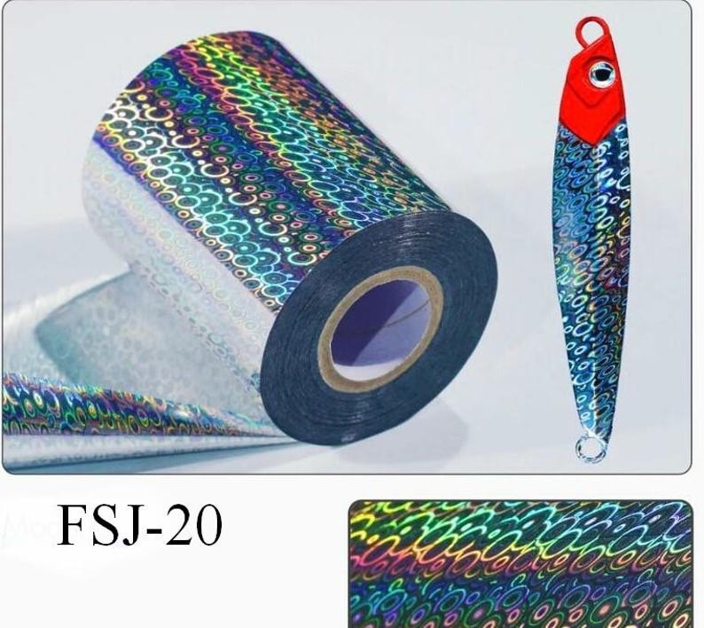 May include: A roll of holographic film featuring a repeating circular pattern with a rainbow sheen, displayed alongside a fishing lure with a red head and a matching holographic body. The text FSJ-20 is visible, along with a sample of the pattern.