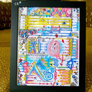 May include: Framed abstract art print in a black frame. The artwork displays colourful geometric shapes, lines, and patterns in shades of blue, yellow, pink, and red. The initials "SD*" are in the top left corner.