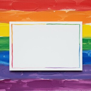 May include: A white rectangular card with a colorful border rests on a background of rainbow-colored brushstrokes. The background features horizontal bands of red, orange, yellow, green, blue, and purple paint.