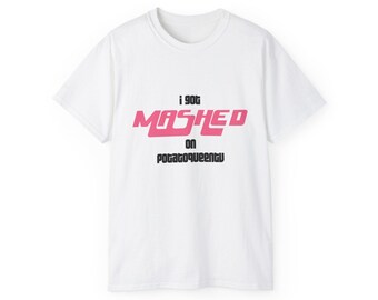 May include: White t-shirt with the text "i got mashed on potatoqueentu" in pink and black lettering. The shirt has a crew neck and short sleeves. The text is centered on the front of the shirt.