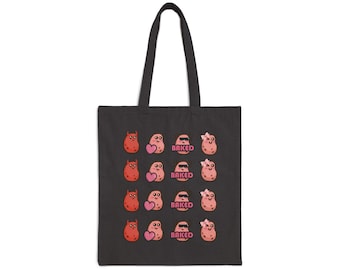 May include: A black tote bag featuring a repeating grid pattern of four different cartoon potato characters. The designs include a red devil potato, a potato holding a pink heart, a potato wearing sunglasses with the text BAKED, and a potato with a bow.
