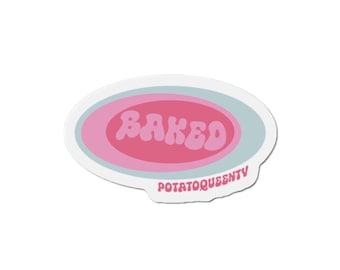 May include: Oval sticker with the word "BAKED" in pink, retro-style lettering. The sticker has a light blue and pink oval design, with the text "POTATOQUEENTV" in a smaller font at the bottom.