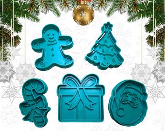 May include: A collection of five teal-colored Christmas-themed cookie cutters. The shapes include a gingerbread man, Christmas tree, candy cane, gift box with a bow, and Santa Claus face. These cutters are ideal for holiday baking.