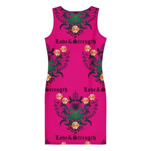 A back-facing flat-lay view of the hot pink tank dress displaying symmetrical winged heart graphics and lettering.