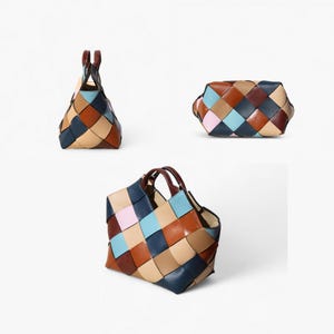 May include: A collection of three woven leather handbags in various shapes. The bags feature a patchwork design with squares of navy, light blue, tan, brown, and pink leather. The bags have brown handles and are set against a white background.