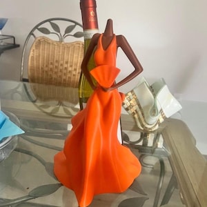 wine bottle with lady in red dress Sexy Lady on Bicycle Wine Bottle Holder ImportedGiftDepot