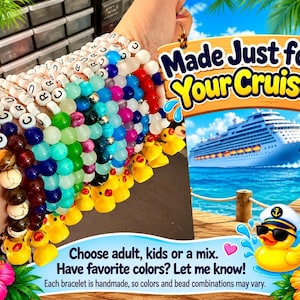 A wrist wearing a stacked collection of colorful handmade beaded cruise bracelets with tiny yellow duck charms.