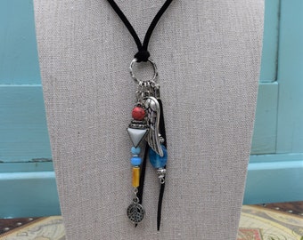 Freedom Necklace with Peace Symbol, Angel Wing, and Charms on Black Velvet