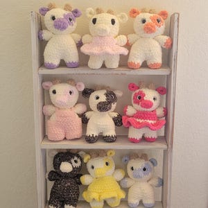 Colorful handmade Moo Cow plush, Crocheted stuffed animal gifts, pink purple blue yellow black orange brown, wearing clothes fancy farm doll