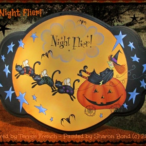 May include: A black and yellow Halloween-themed sign with a witch flying on a pumpkin. The sign says "Night Flier!" and is decorated with stars and bats.