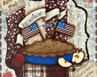 May include: A wooden sign with a red, white, and blue American flag theme. The sign features a pie with apples, a banner that says "American", and the words "Apple Pie!" in the top left corner. The sign is designed and painted by Sharon Bond.
