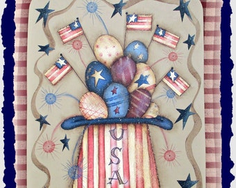 May include: A painted wooden sign with a patriotic theme. It features a top hat with red, white, and blue stripes and the word "USA" written on it. The hat is filled with red, white, and blue eggs and small American flags. The background is a red and white gingham pattern.