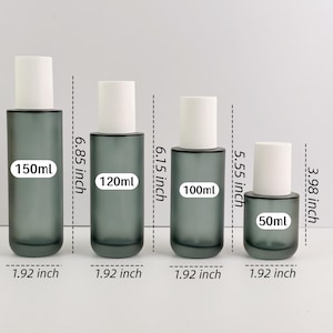May include: Four grey glass bottles with white caps, labelled 150ml, 120ml, 100ml, and 50ml. The bottles are 4.88 cm wide and range in height from 10.11 cm to 17.40 cm.