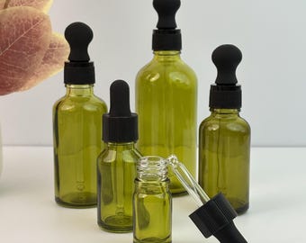 Frascos cuentagotas de vidrio con tapa de plástico negra, envases rellenables para cosméticos de ojos, aceites esenciales, sérums caseros, tónicos y productos de cuidado personal y belleza.