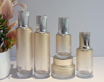Envases de lujo de vidrio degradado dorado para el cuidado de la piel, envases cosméticos rellenables para sueros, lociones, cremas y cremas caseras.