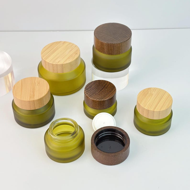 refillable-frosted-cosmetic-jars-with-wood-grain-lid-leak-proof-glass