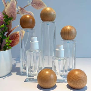 Envase de vidrio transparente para cosméticos con tapa de madera, frasco vacío con dosificador de loción y tarro de crema, envases para el cuidado de la piel, productos de belleza caseros de nicho.