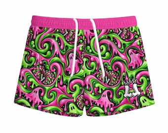 May include: Athletic shorts featuring a vibrant pattern of swirling neon green and hot pink slime, interspersed with small ghost figures and pom-poms. The shorts have a solid hot pink waistband, white drawstring cords, and a white crown logo.
