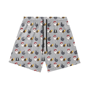 May include: Gray mesh shorts with a repeating pattern of cartoon baseballs wearing red hats and holding lit bombs. The shorts have a drawstring waistband and a relaxed fit, perfect for casual wear.