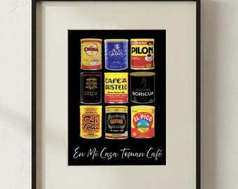 May include: A framed wall art print featuring a grid of nine colorful coffee cans from various brands including Pilon, Cafe Bustelo, and El Pico, set against a black background with the white cursive text En Mi Casa Toman Cafe below.