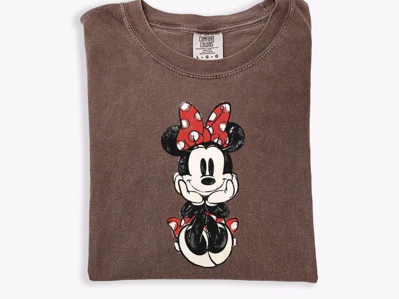 May include: A set of three ceramic mugs with a speckled, matte finish. The mugs are in shades of cream, light gray, and dark gray. Each mug has a simple, minimalist design and a rounded handle.