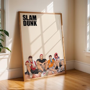 May include: Framed poster featuring the text "SLAM DUNK" above an illustration of five seated basketball players. The artwork has a beige background and a wooden frame. The players are in various poses, with a basketball visible.