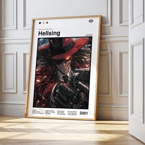 May include: A framed poster featuring the anime series "Hellsing." The artwork depicts a character in a red hat and coat, holding a gun. The poster has the title "Hellsing" at the top and the year "2001" at the bottom.