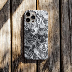 May include: A rectangular smartphone case featuring a high-gloss, liquid metal aesthetic with a silver and grey chrome finish. The surface displays a fluid, rippled pattern that mimics molten metal, complete with circular bubble-like indentations.