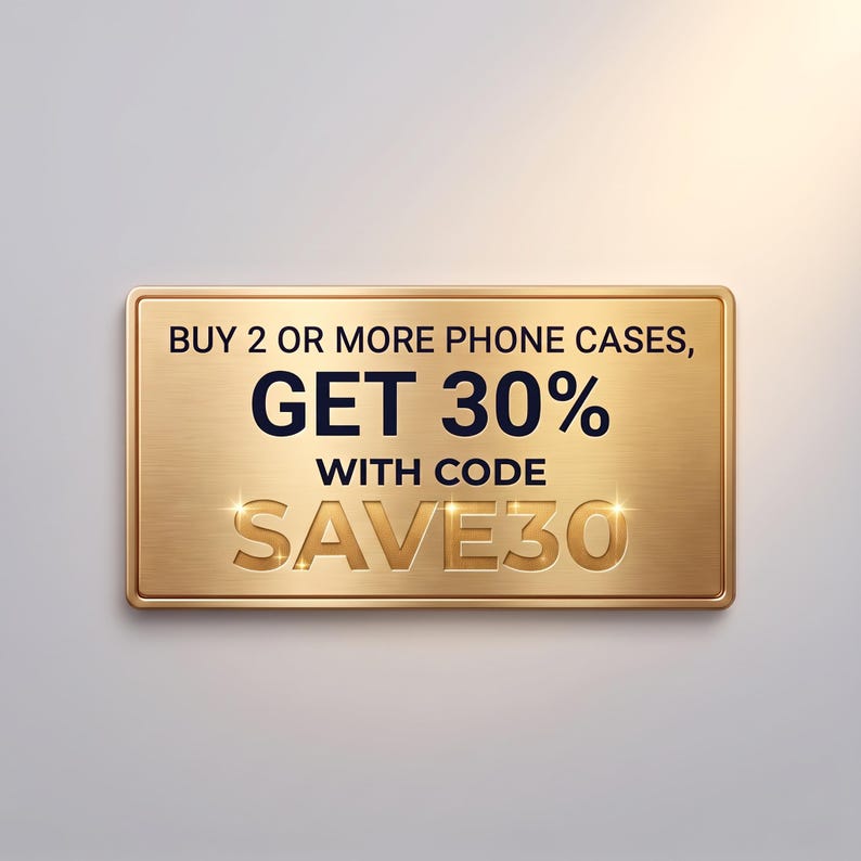 May include: A rectangular gold-toned plaque with a brushed metallic finish. The text reads: BUY 2 OR MORE PHONE CASES, GET 30% WITH CODE SAVE30. The lettering is dark blue and embossed gold, featuring a polished, reflective surface appearance.
