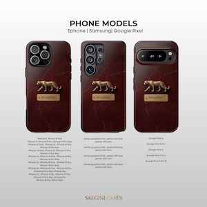 May include: Three dark red marble-patterned phone cases featuring a gold-colored leopard emblem and a rectangular nameplate with the text Seraphine. The text PHONE MODELS iPhone | Samsung | Google Pixel is displayed above the cases.