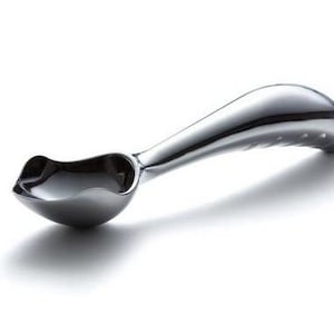 May include: A silver ice cream scoop with a curved handle and a textured grip.