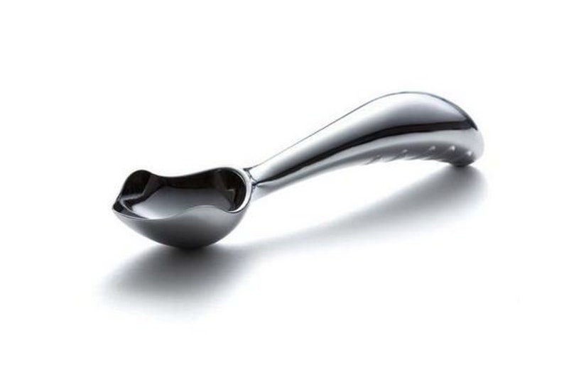 May include: A silver ice cream scoop with a curved handle and a textured grip.