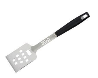 May include: A silver spatula with a black handle and a bottle opener. The spatula has a slotted design and the handle has the word "IBDO" printed on it.