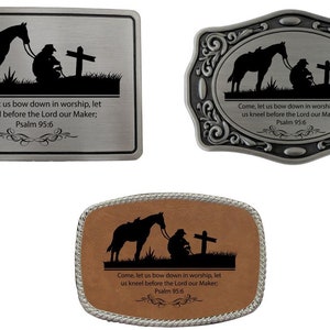 May include: Three different belt buckles with a silhouette of a person kneeling beside a horse and a cross. The buckles are made of metal and leather. The text on the buckles reads: "Come, let us bow down in worship, let us kneel before the Lord our Maker; Psalm 95:6".