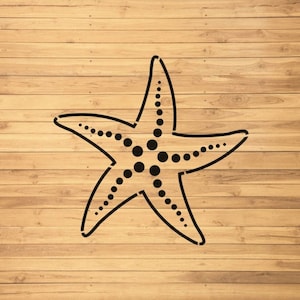 May include: A black and white silhouette of a starfish with a dotted pattern on a light brown wood background.
