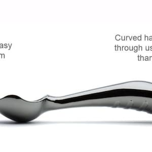 May include: A silver ice cream scoop with a curved handle and a pointed front. The handle has a textured grip. The scoop is designed to easily scoop hard ice cream.