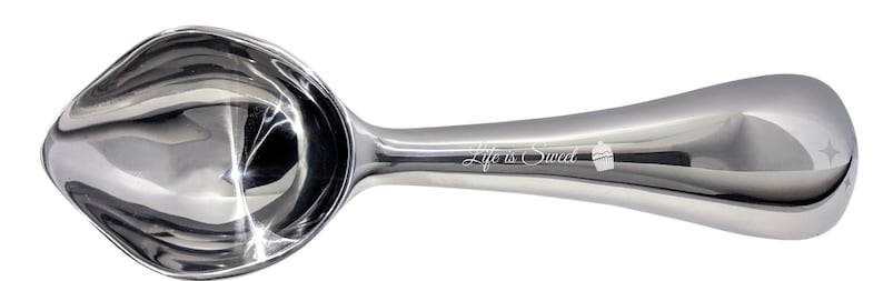 May include: A silver ice cream scoop with a curved handle and a polished finish. The handle has the words "Life is Sweet" engraved on it.