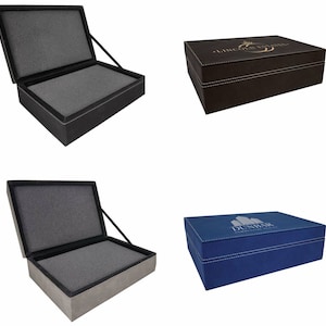 May include: Six different gift boxes with lids open. The boxes are made of brown, grey, and blue fabric with a variety of designs and text. The boxes are all closed and have a hinged lid.