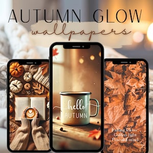 May include: Three smartphones displaying autumn-themed wallpapers. The screens feature images of pumpkins, fall leaves, a coffee mug with "hello autumn" text, and the words "Falling leaves, Golden light, Peaceful mind". The background includes a cozy knitted blanket.
