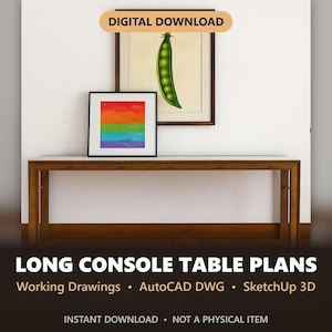 May include: A long wooden console table with a flat top and four legs. Above the table, two framed pictures hang on a white wall: one features a green pea pod illustration, and the other displays a horizontal rainbow-colored square design.