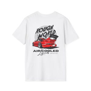May include: White t-shirt featuring a red sports car graphic with a large rear wing. The design includes the words "ROUGH WORLD" above the car and "AIR/COOLED Legends" below, with "RWB 964 CLUB" at the bottom.