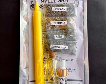 May include: A spell jar kit in a clear plastic bag. The kit includes a yellow candle, small bags of lavender, chamomile, mint, and lemon balm, a small glass bottle, and a bottle of Happiness Oil. The words "SPELL JAR" are printed on the bag.