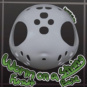 May include: A light gray, dome-shaped fursuit head base featuring large eye openings, a series of circular ventilation holes across the top and bottom, and the text "Worm on a String Fursuit Base" and "By: SticknTrickCreations" printed on the image.